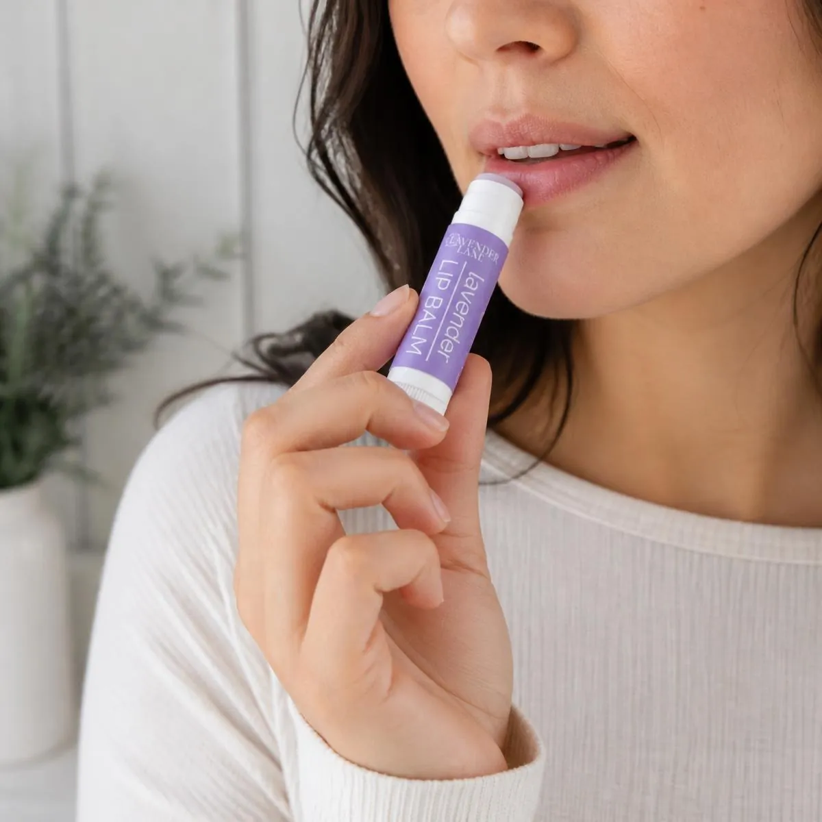 Lavender Lane lip balm in use applying